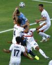 Costa Rica's Junior Diaz (15) fouls Uruguay's Diego Lugano (C, arms raised) resulting in a penalty during their 2014 World Cup Group D soccer match at the Castelao arena in Fortaleza June 14, 2014. (Mike Blake/Reuters)