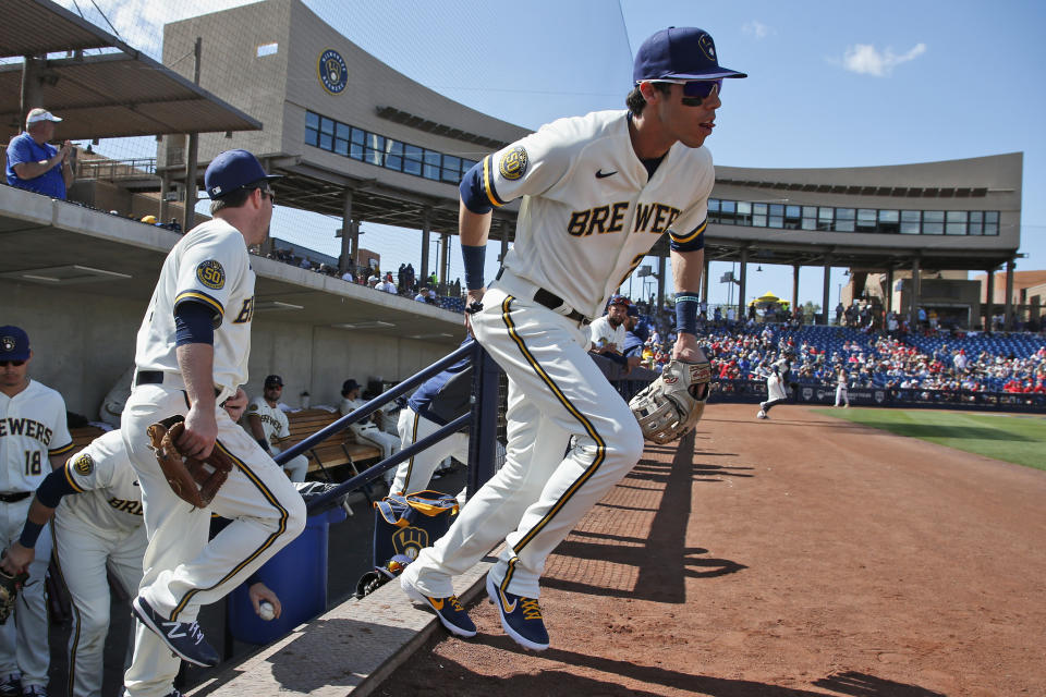 Milwaukee Brewers' Christian Yelich runs onto the field for a spring training baseball game against the Los Angeles Angels, Sunday, March 8, 2020, in Phoenix, Ariz. (AP Photo/Sue Ogrocki)