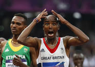 Britain's Mo Farah reacts as he wins the men's 5000m final at the London 2012 Olympic Games at the Olympic Stadium August 11, 2012. REUTERS/Lucy Nicholson (BRITAIN - Tags: SPORT ATHLETICS OLYMPICS) 