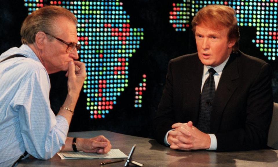 Larry King, left, conducting the 1999 Larry King Live interview during which Donald Trump announced he was considering running to be US president.