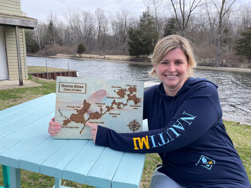 Melissa Kunnert points out the location of NautiMI on the River on March 19.