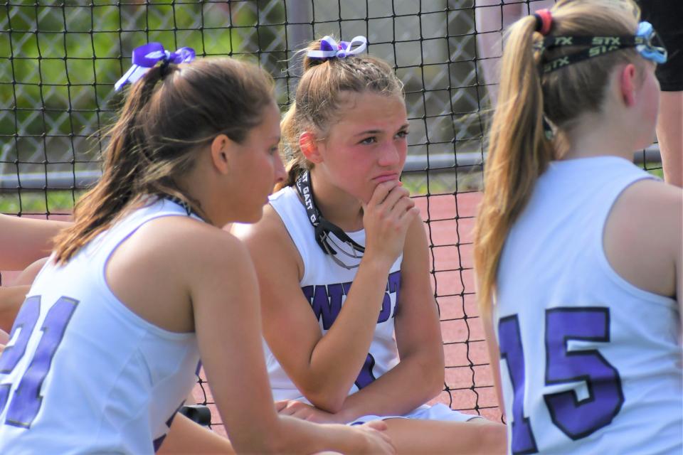 Cherry Hill West freshman Tatum Woods listens to a halftime speech during a playoff game against Mainland