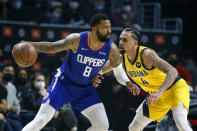 Los Angeles Clippers forward Marcus Morris Sr. (8) dribbles against Indiana Pacers guard Duane Washington Jr. (4) during the first half of an NBA basketball game in Los Angeles, Monday, Jan. 17, 2022. (AP Photo/Ringo H.W. Chiu)