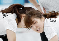 Curling - Pyeongchang 2018 Winter Olympics - Women's Semi-final - South Korea v Japan - Gangneung Curling Center - Gangneung, South Korea - February 23, 2018 - Second Yumi Suzuki of Japan reacts as she sweeps. REUTERS/John Sibley