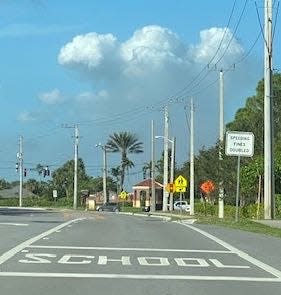 Clouds of fine particulate matter from the Dec. 2 sugar cane field burn near Wellington rise over the road ahead.