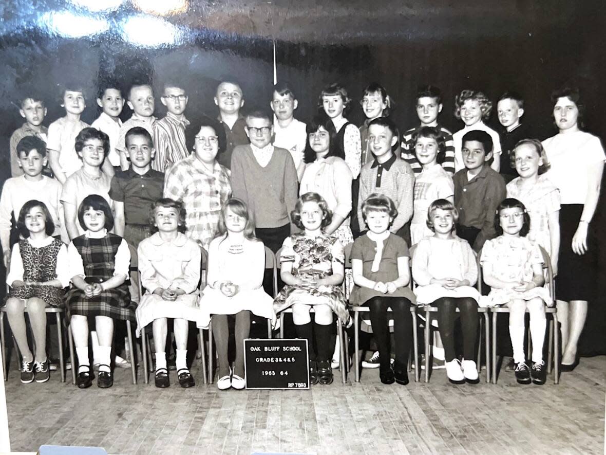 Marlene Mutch, far right, stands with her class of 1963 at Oak Bluff School. She had 33 students and taught grades 3, 4 and 5 that year.  (Submitted by Marlene Mutch - image credit)