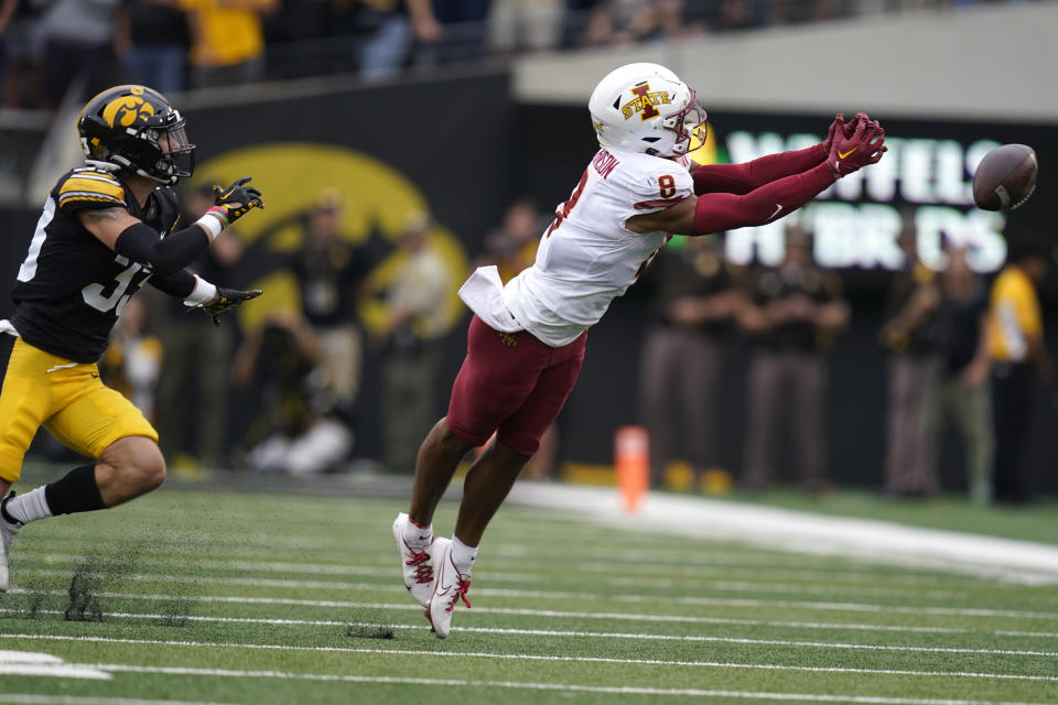 Iowa State wide receiver Xavier Hutchinson (8) looks to catch a pass ahead of Iowa defensive back Riley Moss (33) during the first half of an NCAA college football game, Saturday, Sept. 10, 2022, in Iowa City, Iowa. The pass was incomplete. (AP Photo/Charlie Neibergall)