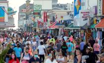 Visitors crowd the boardwalk on Memorial Day weekend in Ocean City, Maryland