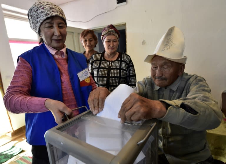 Around 24% of the electorate cast their ballots in the first six hours, with some older people voting at home such as this man in Arashan village just outside the Kyrgyz capital, Bishkek