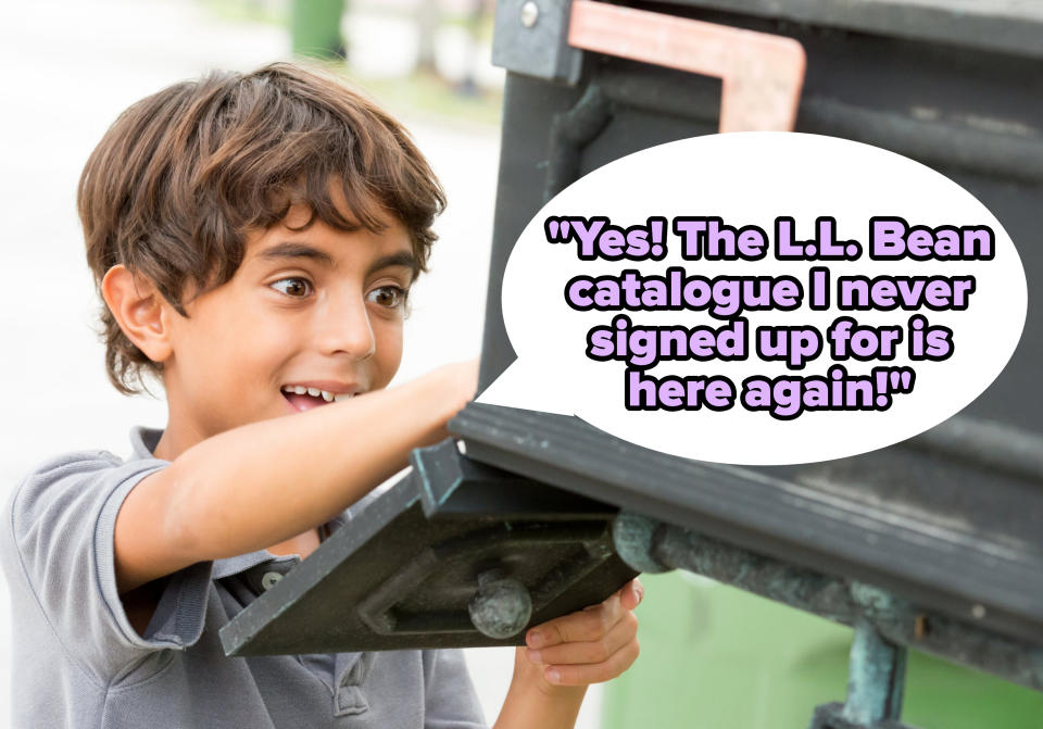 A little boy excitedly checking the mailbox