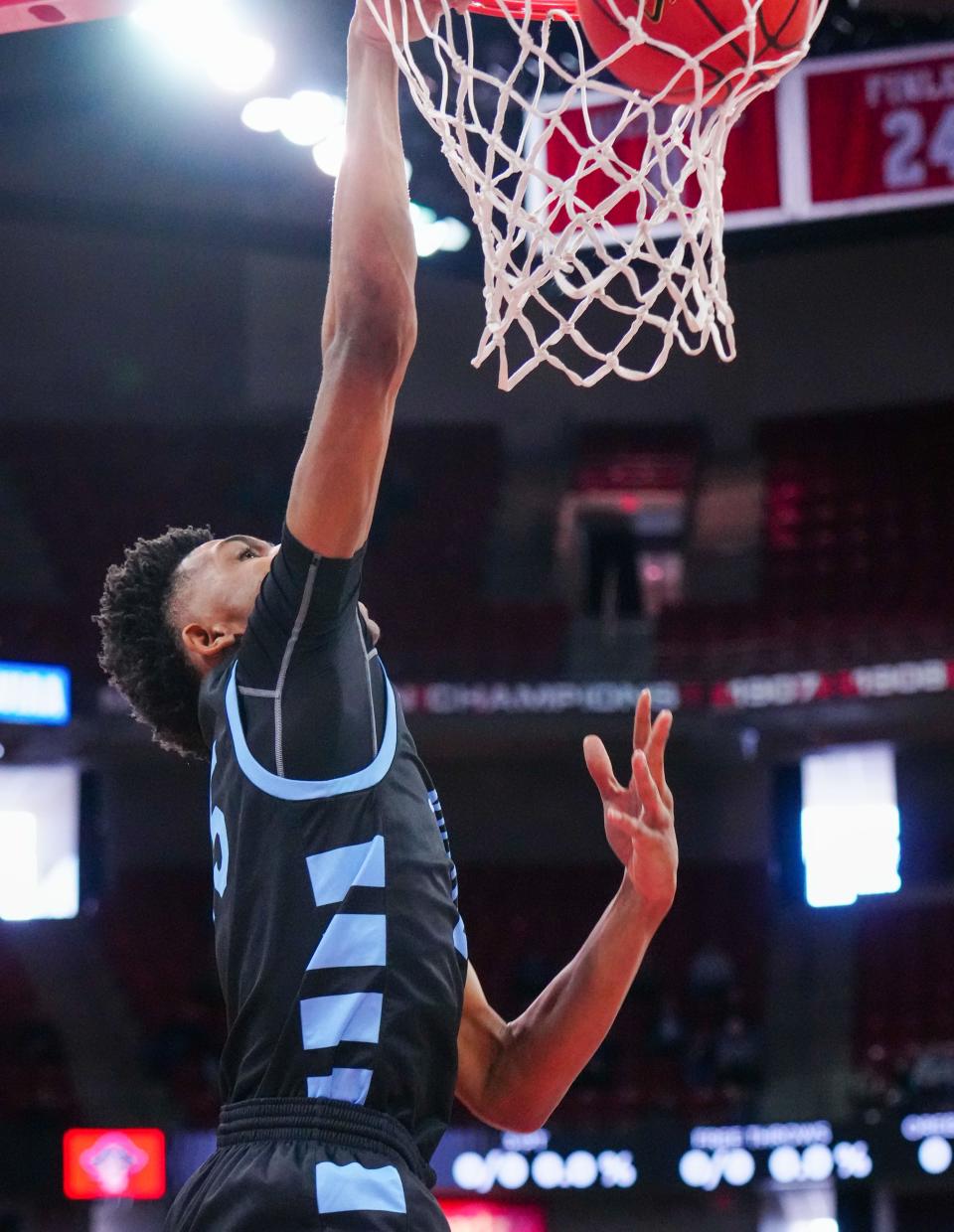 Nicolet's Davion Hannah (25) dunks during the WIAA Division 2 state boys basketball semifinal against Pewaukee at the Kohl Center in Madison on Friday, March 17, 2023.
