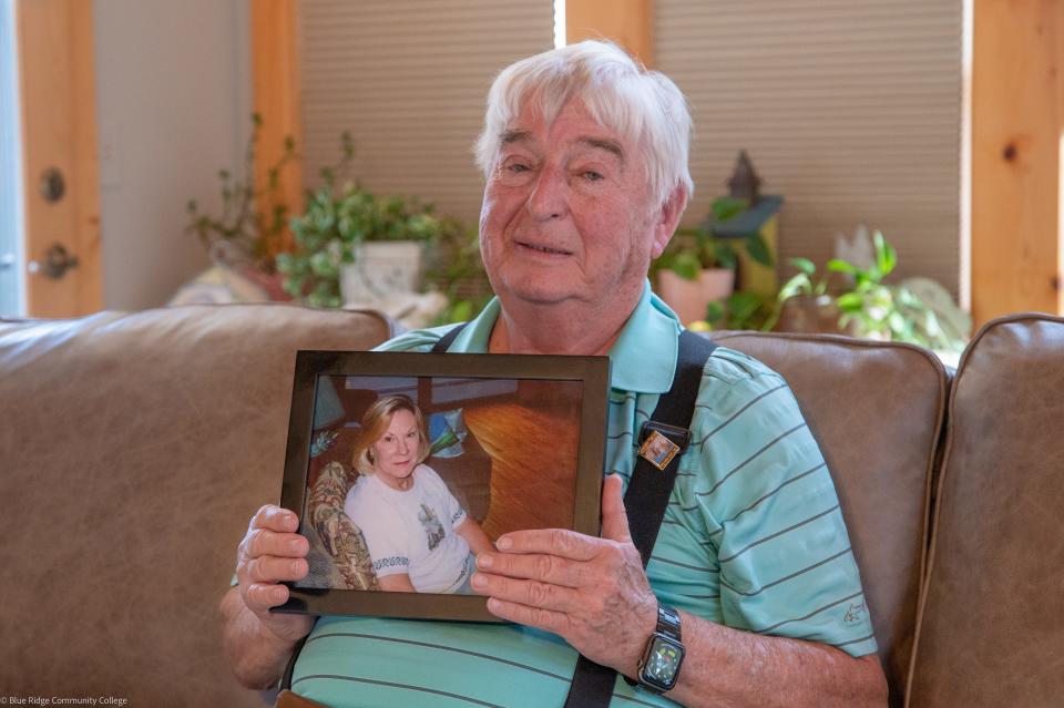 Paul Young holds a photo of his late wife, Mauriene "Renee" Young.