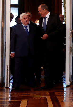 REFILE - CORRECTING BYLINE Russian Foreign Minister Sergei Lavrov and Syrian Foreign Minister Walid al-Moualem enter a hall for their talks in Moscow, Russia August 30, 2018. REUTERS/Maxim Shemetov