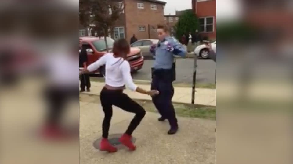 A cop managed to break up a fight between teenagers by calling out a young girl to a dance off. Photo: Facebook/Adore Liyah