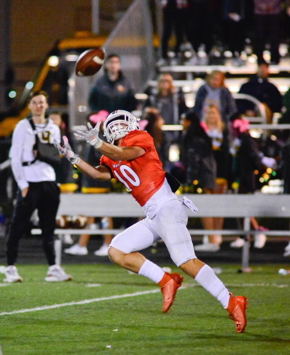 2022 Taunton graduate Trent Santos brings in a long pass during a 2021 game against King Philip.