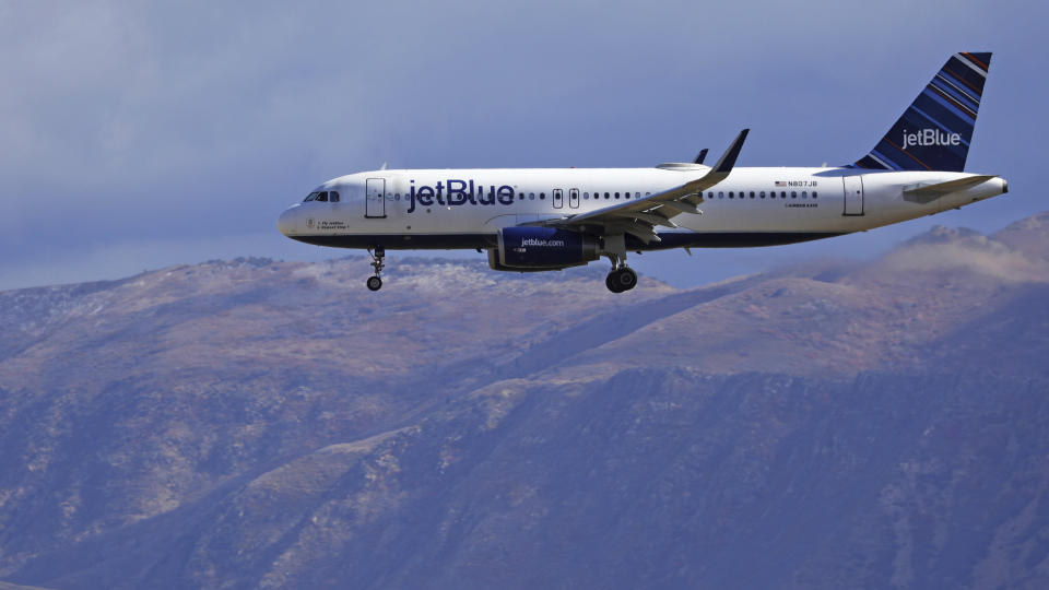 JetBlue's efforts to reduce in-flight waste include a recycling program to sort and recycle bottles and cans served on domestic flights. (Photo: ASSOCIATED PRESS)