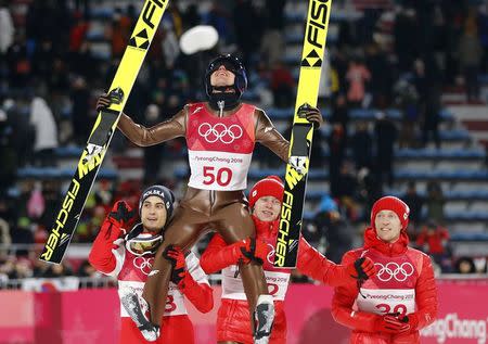 Ski Jumping - Pyeongchang 2018 Winter Olympics - Men's Large Hill Individual Final - Alpensia Ski Jumping Centre - Pyeongchang, South Korea - February 17, 2018 - Kamil Stoch of Poland celebrates with Maciej Kot of Poland, Dawid Kubacki of Poland and Stefan Hula of Poland. REUTERS/Dominic Ebenbichler