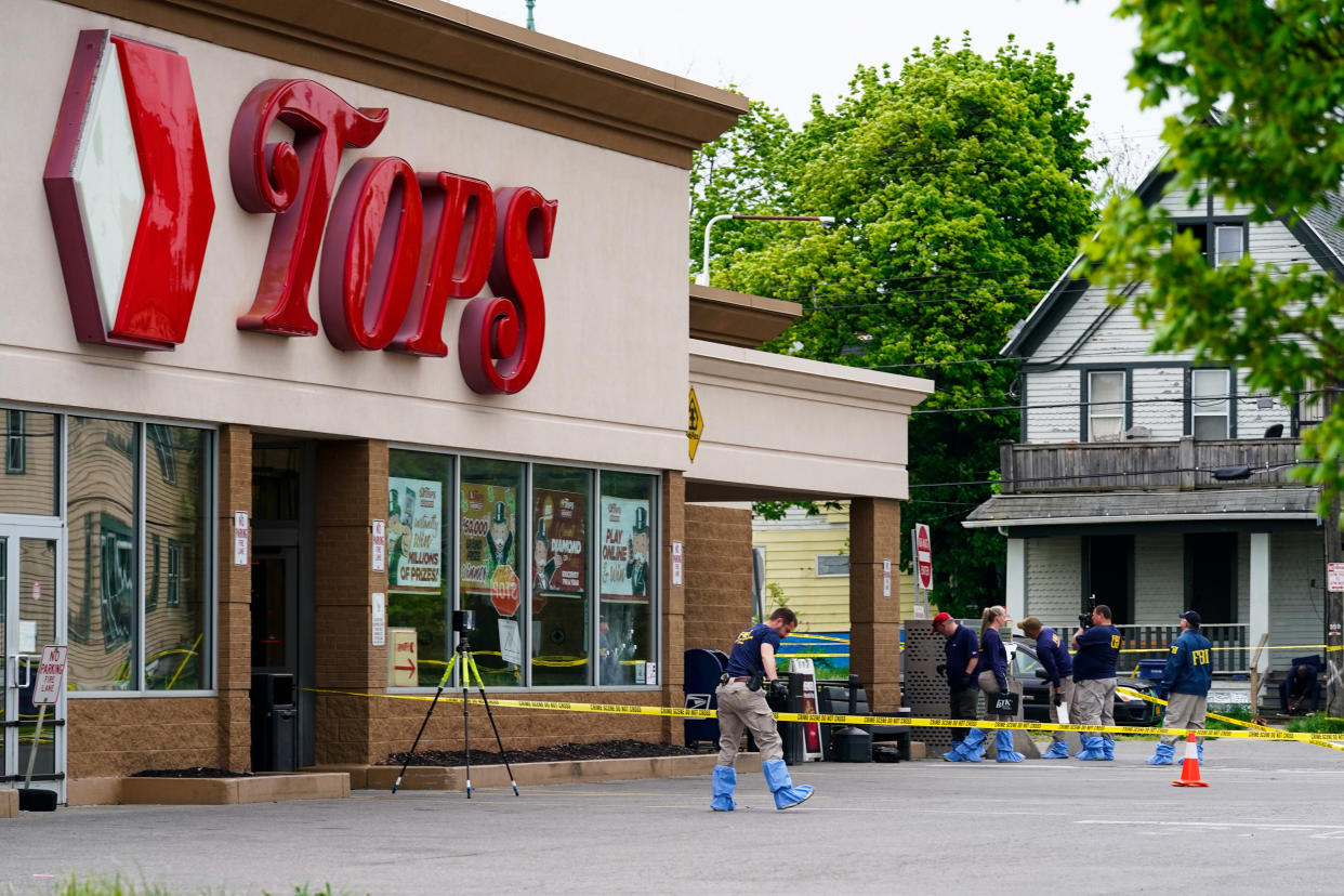 Investigators work at a Tops Friendly Market (Matt Rourke / AP)