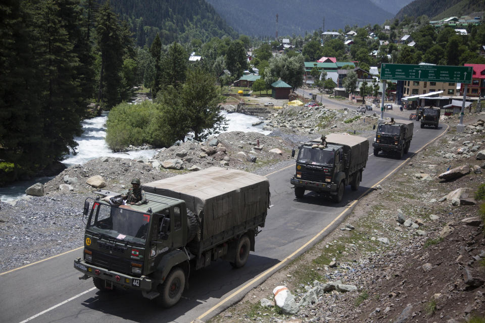 An Indian army convoy moves on the Srinagar- Ladakh highway at Gagangeer, north-east of Srinagar, India, Wednesday, June 17, 2020. Indian security forces said neither side fired any shots in the clash in the Ladakh region late Monday that was the first deadly confrontation on the disputed border between India and China since 1975. China said Wednesday that it is seeking a peaceful resolution to its Himalayan border dispute with India following the death of 20 Indian soldiers in the most violent confrontation in decades. (AP Photo/Mukhtar Khan)