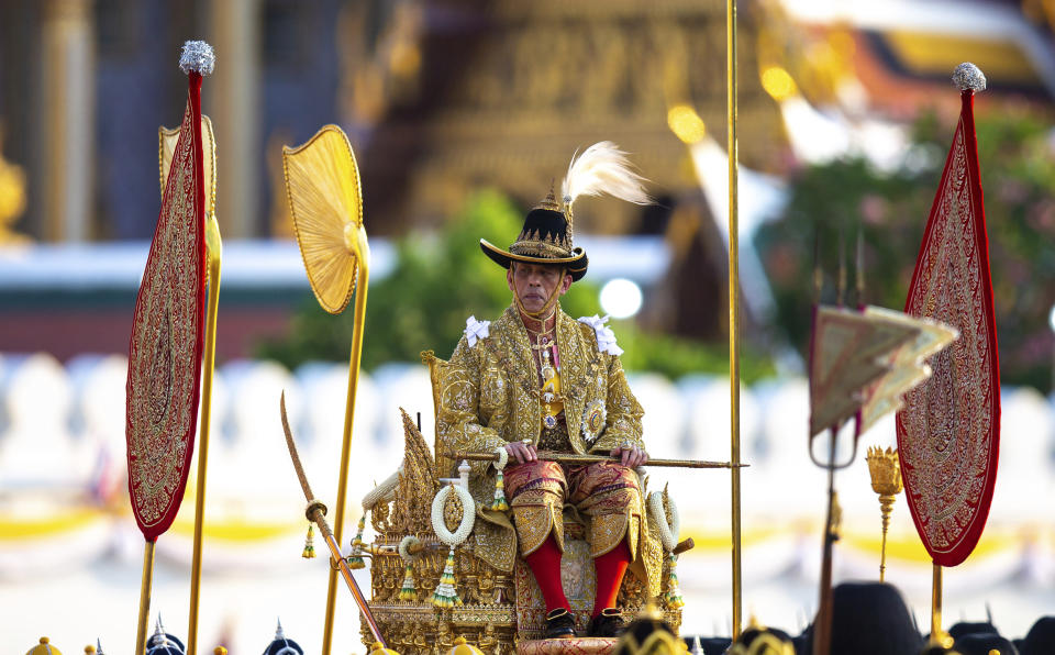 Thailand's King Maha Vajiralongkorn is carried on a palanquin through the streets outside the Grand Palace for the public to pay homage during the second day of his coronation ceremony in Bangkok, Sunday, May 5, 2019. Vajiralongkorn was officially crowned Saturday amid the splendor of the country's Grand Palace, taking the central role in an elaborate centuries-old royal ceremony that was last held almost seven decades ago. (AP Photo/Wason Wanichakorn)