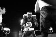 <p>Wayne Lowe has opponent Brian Davis, both from Harlem’s 28th Precinct, backing up into the ropes during a grudge match at the Brooklyn Smoker in the parking lot of Gargiulo’s Italian restaurant in Coney Island, Brooklyn on Aug. 24, 2017. (Photo: Gordon Donovan/Yahoo News) </p>