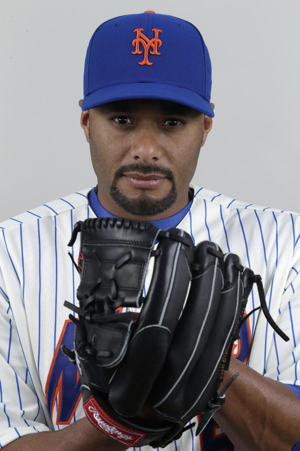 FILE - In this 2013 file photo, New York Mets pitcher Johan Santana poses at spring training camp in Port St. Lucie, Fla. The two-time AL Cy Young Award winner has agreed to a minor league contract with the Baltimore Orioles, in a deal announced Tuesday, March 4, 2014, as he tries to come back from the second major operation on his left shoulder. (AP Photo/Julio Cortez, File)