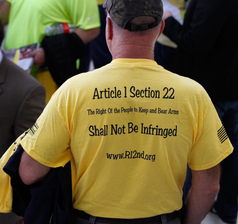 A gun-rights supporter attends a rally at the State House before hearings on gun-control legislation in 2018.