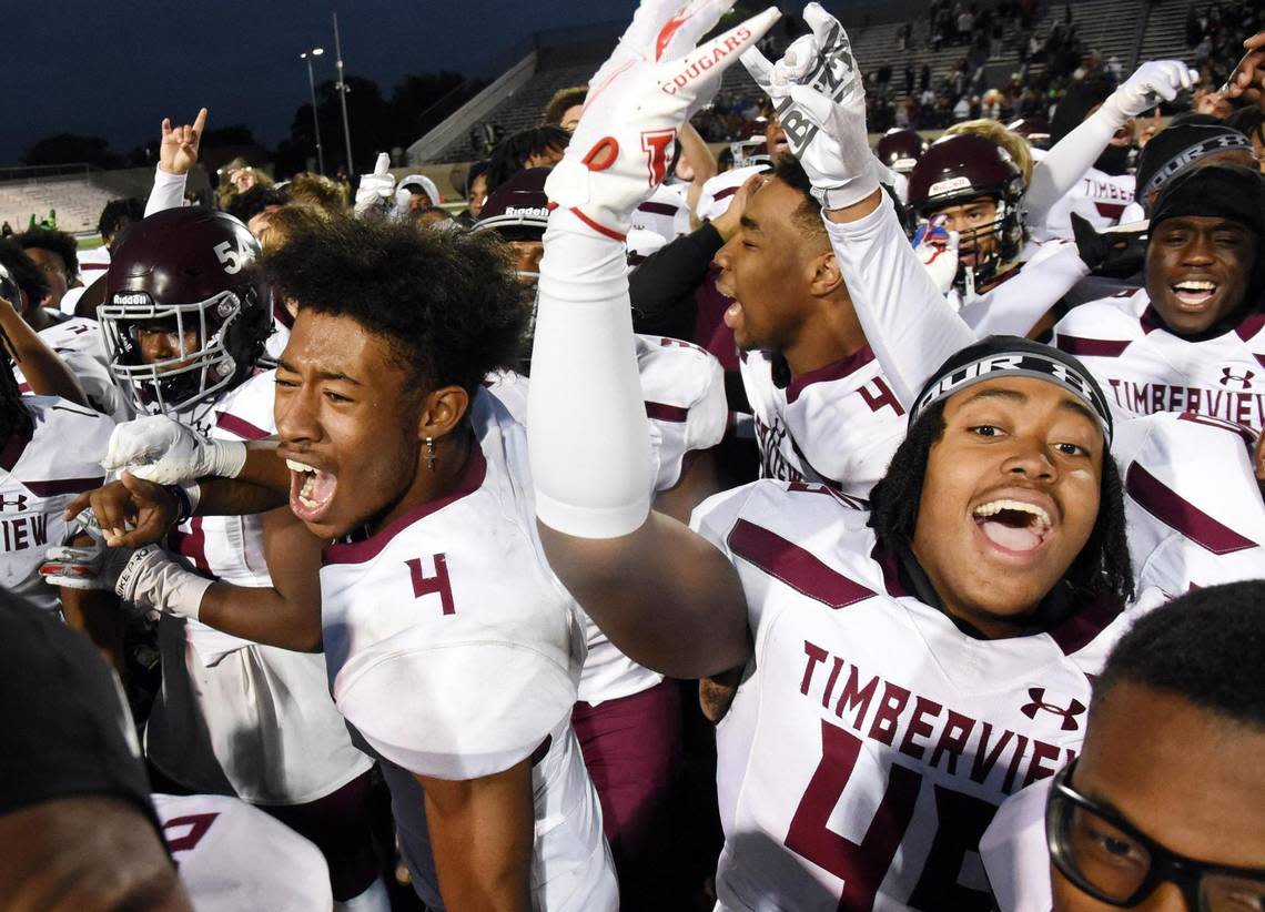 Manfield Timberview’s Jon Smith, left (4), and Jalen Love celebrate with teammates their 28-26 win over Frisco Reedy in Friday’s November 25, 2022 5A Division 1 Regional playoff football game at Pennington Field in Bedford, Texas. Special/Bob Haynes