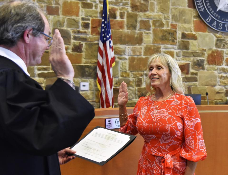 Cynthia Meyer is sworn in for a second term on the Bastrop City Council by 423rd District Court Judge Chris Duggan.