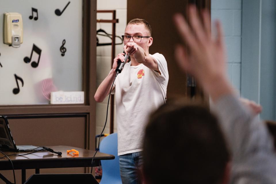 Jehred Bennett, 20, points to a fellow attendees of Advocates For Success, where he often leads a group with mutual interest in all things related to the Marvel multiverse.