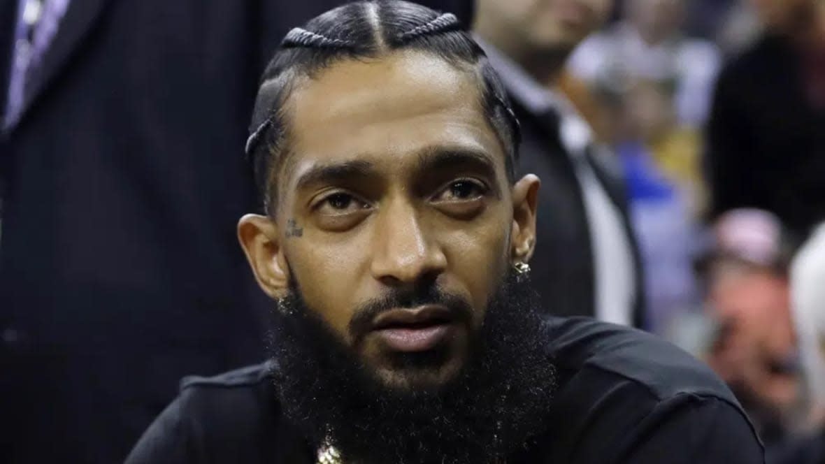 Rap star Nipsey Hussle attends an NBA basketball game between the Golden State Warriors and the Milwaukee Bucks in Oakland, California in March 2018. (Photo: Marcio Jose Sanchez/AP, File)