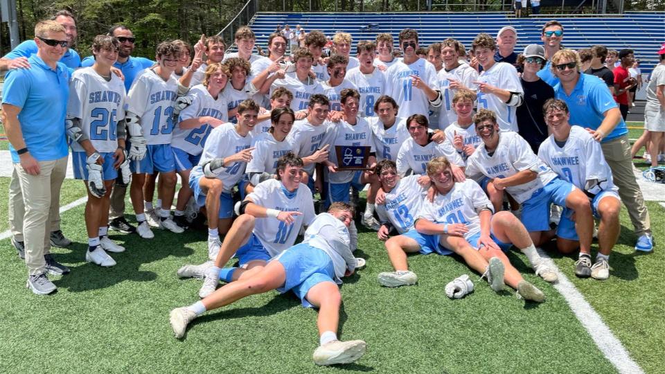 Members of the Shawnee boys lacrosse team pose with the South Jersey Group 3 championship trophy after their 14-11 win over Clearview at Shawnee Stadium on Saturday, May 28, 2022.