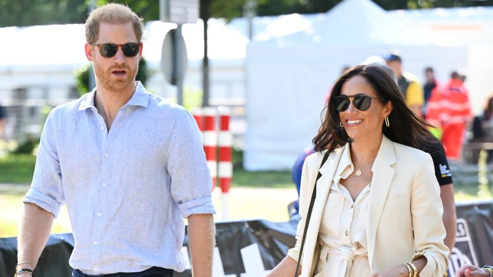 Prince Harry, Duke of Sussex and Meghan, Duchess of Sussex attend the cycling medal ceremony at the Cycling Track during day six of the Invictus Games 