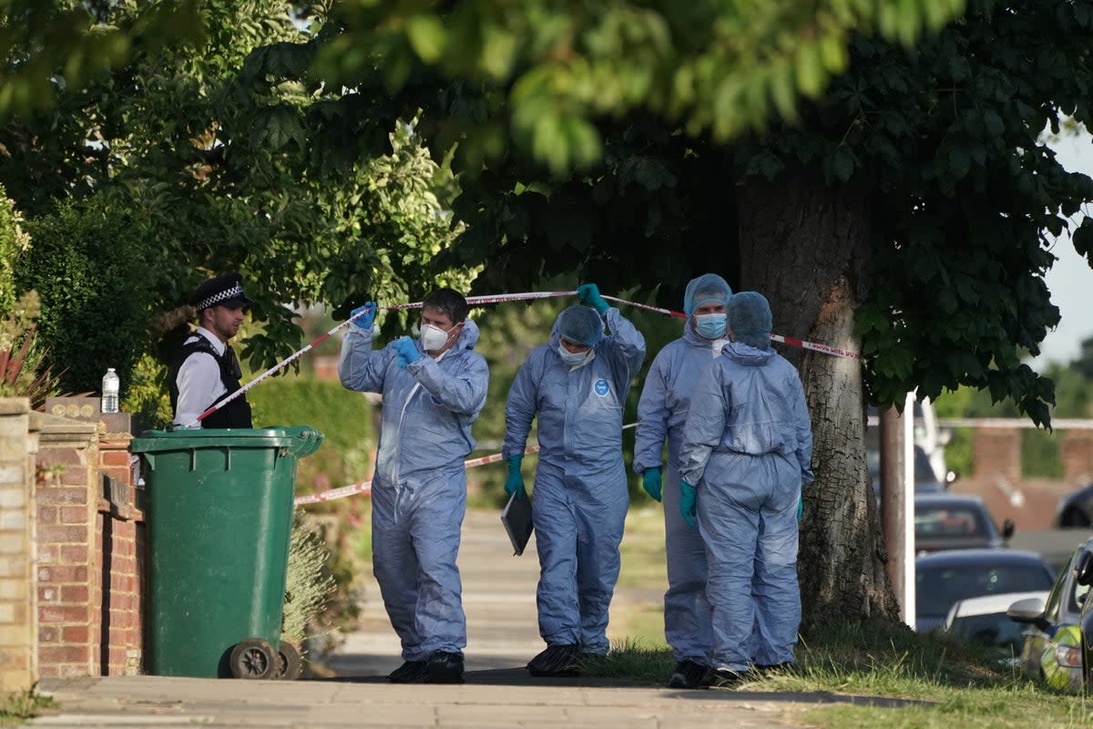 Forensic Officers at the scene in Brookside South, Barnet, north London, after a 37-year-old woman and five-year-old child were found fatally stabbed. The Metropolitan Police said the pair, believed to be mother and son, were pronounced dead at the scene and a 37-year old man, believed to have been known to the victims, has been arrested on suspicion of murder. Picture date: Tuesday June 21, 2022 (Lucas Cumiskey/PA) (PA Wire)