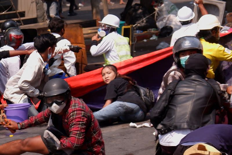 Angel lies on the ground before she was shot in the head in Mandalay