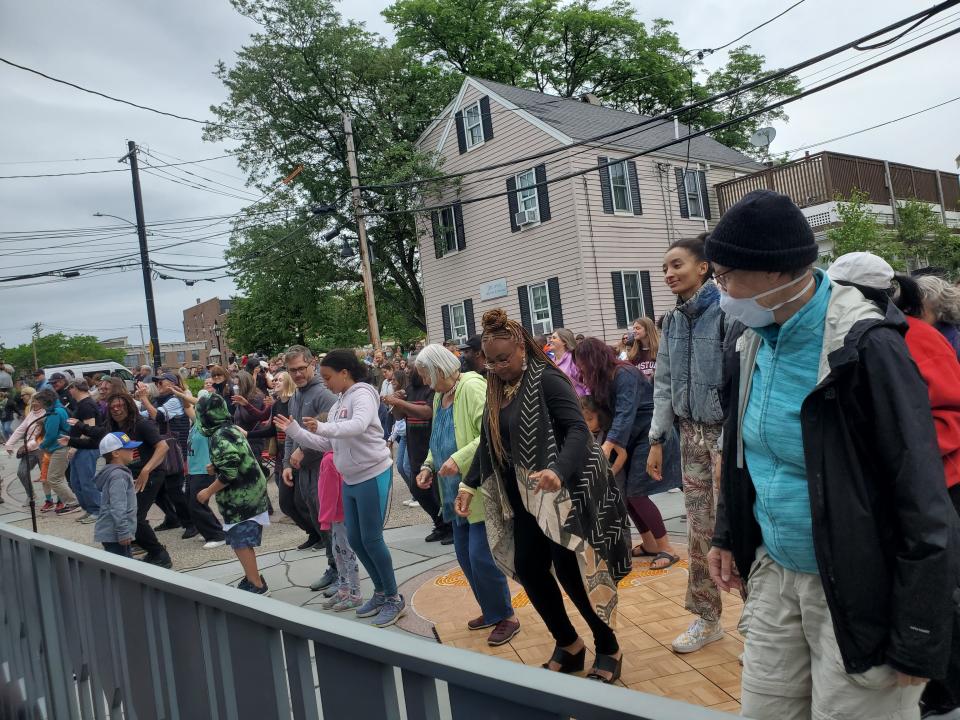 A street-wide dance party during the performance of "Uproar: A Celebration of African American Creativity“ led by Theater For The People at the African Burying Ground Memorial Park in Portsmouth Sunday, June 19, 2022.