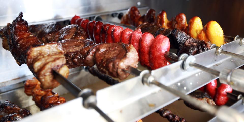 Brazilian barbecue cooks at Real Brazil Restaurant and Market on Tremont Street in Taunton on Thursday, April 14, 2022.