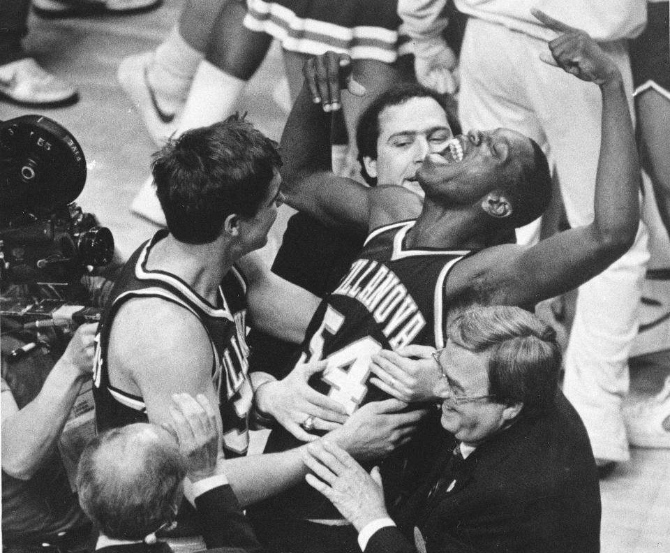 FILE - Villanova's Ed Pinckney (54) yells out as he is surrounded by teammates after the Wildcats defeated Georgetown for the national championship in the Final Four of the NCAA college basketball tournament in Lexington, Ky., April 1, 1985. (AP Photo/Gary Landers, File)