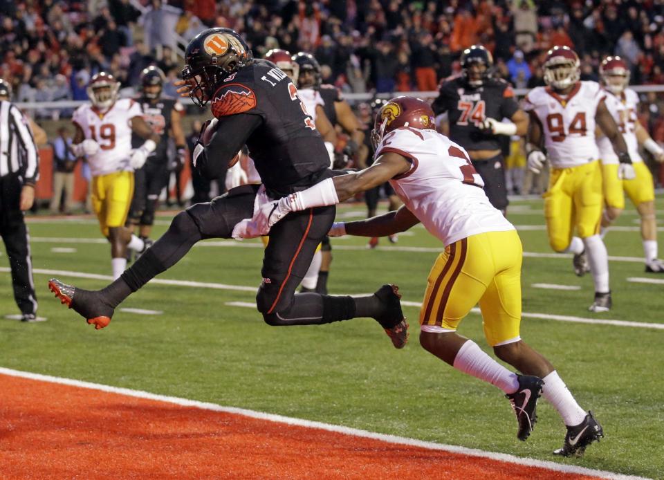 Utah quarterback Troy Williams, left, combined for three touchdowns in a win over USC. (AP Photo/Rick Bowmer)