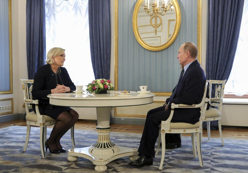 Russian President Vladimir Putin, right, speaks to French far-right presidential candidate Marine Le Pen, in the Kremlin in Moscow, Russia, Friday, March 24, 2017. Le Pen has made multiple visits to Russia, as have her father, niece and other members of the National Front, often meeting with Russian legislators. (Mikhail Klimentyev, Sputnik, Kremlin Pool Photo via AP)