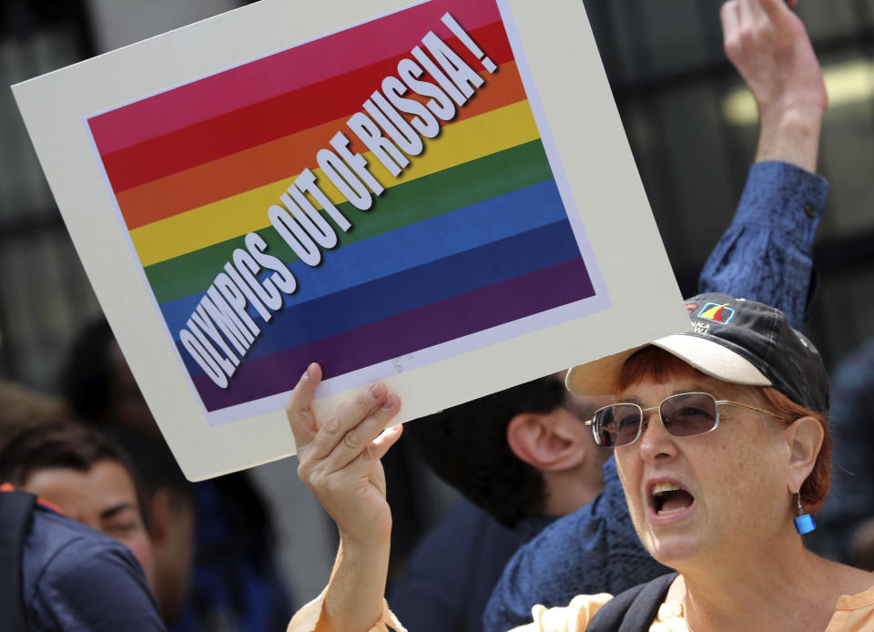 A gay rights activist chant slogans during a demonstration in front of the Russian consulate in New York, Wednesday, July 31, 2013. Russian vodka and the Winter Olympics in Sochi are the prime targets as gays in the United States and elsewhere propose boycotts and other tactics to convey their outrage over Russia's intensifying campaign against gay-rights activism. (AP Photo/Mary Altaffer)