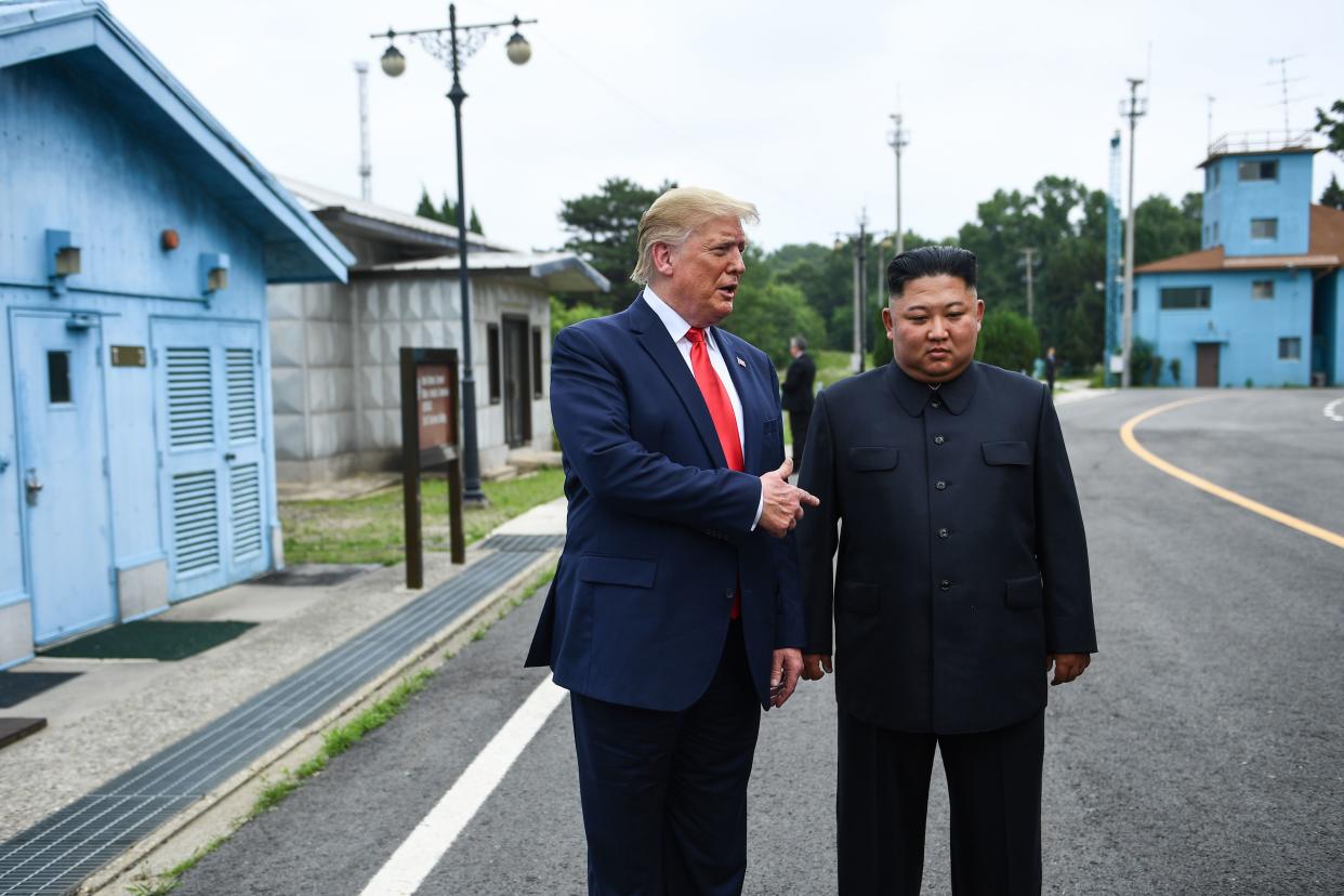 North Korea's leader Kim Jong Un stands with US President Donald Trump south of the Military Demarcation Line that divides North and South Korea, in the Joint Security Area (JSA) of Panmunjom in the Demilitarized zone (DMZ) on June 30, 2019. (Photo by Brendan Smialowski / AFP)        (Photo credit should read BRENDAN SMIALOWSKI/AFP/Getty Images)