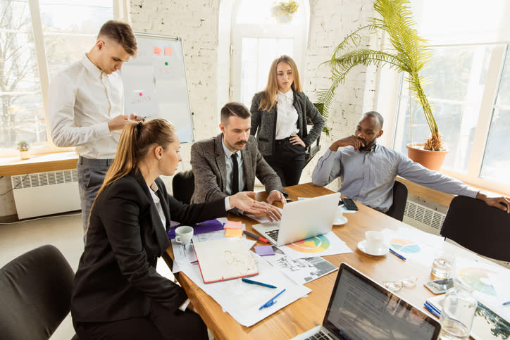 Financial advisors reviewing a marketing plan.