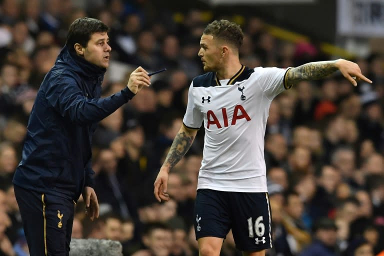 Tottenham Hotspur's manager Mauricio Pochettino gives instructions to defender Kieran Trippier during a match at White Hart Lane in London, on January 8, 2017