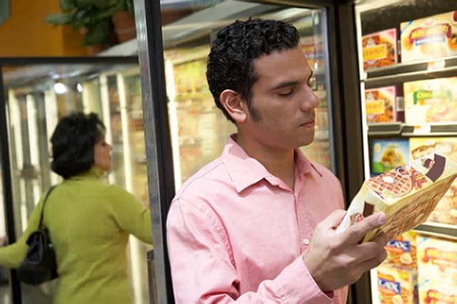 Mid adult man holding a box of frozen desert in a supermarketCreative image #:  200370791-001License type:  Royalty-freePhoto