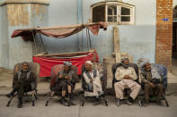 Laborers wait in the street to be hired in Kabul, Afghanistan, Sunday, Sept. 12, 2021. (AP Photo/Bernat Armangue)