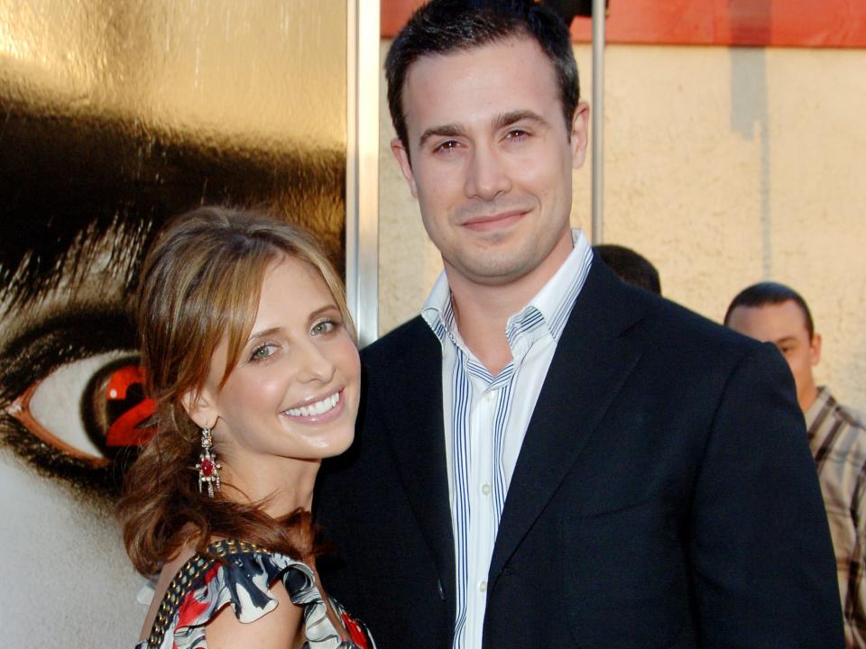 Sarah Michelle Gellar and Freddie Prinze Jr. pose on the red carpet during a 2006 film premiere.