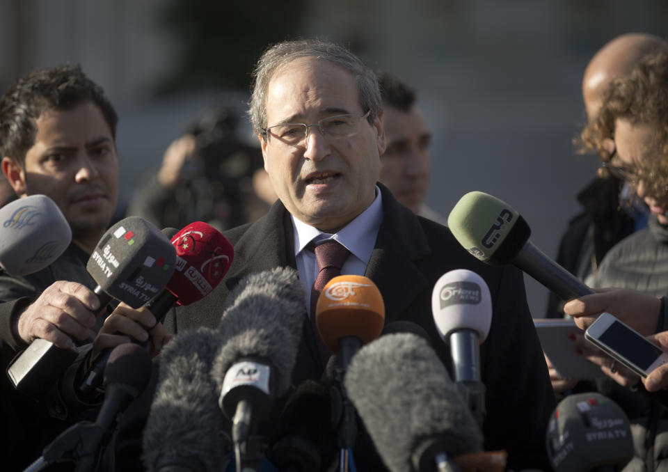 Syrian Deputy Foreign Minister Faisal Makdad answers journalists questions during a short briefing after a meeting with the Syrian opposition at the United Nations headquarters in Geneva, Switzerland, Tuesday, Jan. 28, 2014. Tense negotiations between the Syrian government and opposition broke off earlier than planned Tuesday amid demands that President Bashar Assad put forward another proposal for the future of the country. (AP Photo/Anja Niedringhaus)