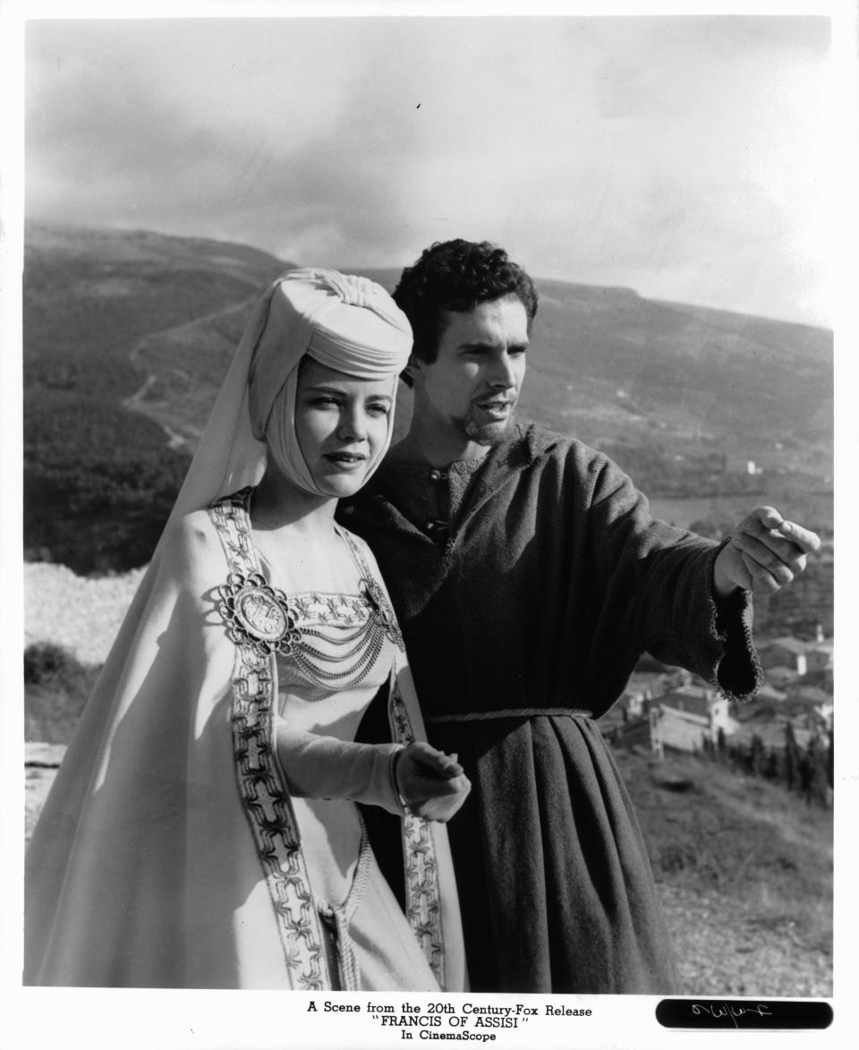 Dolores Hart and Bradford Dillman looking out on the countryside in a scene from the film 'Francis Of Assisi', 1961. (Photo by 20th Century-Fox/Getty Images)