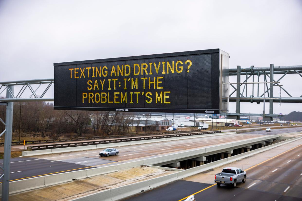 A roadside safety sign in Mississippi reading "Texting and driving? Say it: I'm the problem it's me."